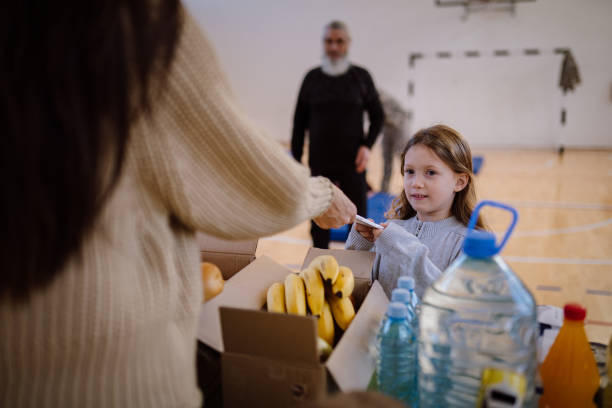 Group of multiracial volunteers working in community charity donation center